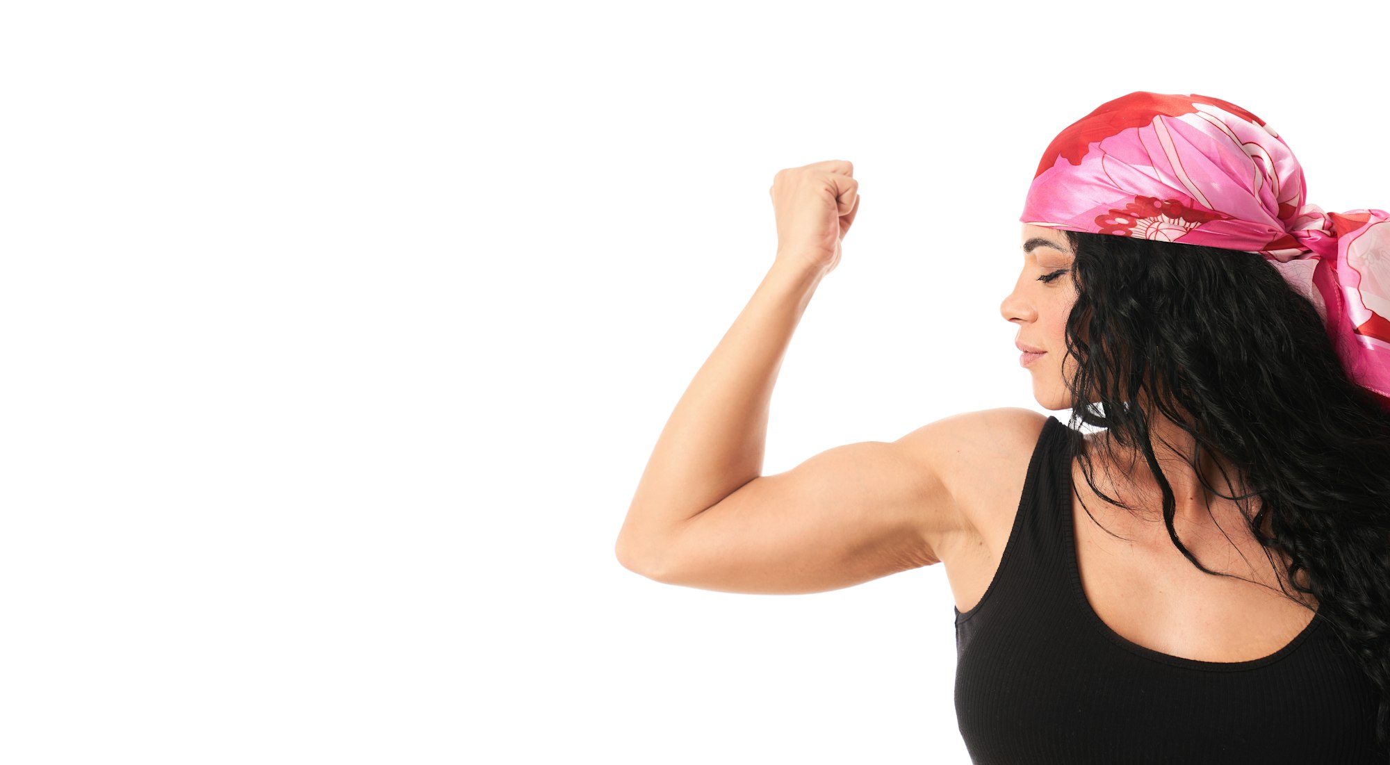 a woman with her fist raised, showing muscle, a feminist symbol of struggle and strength